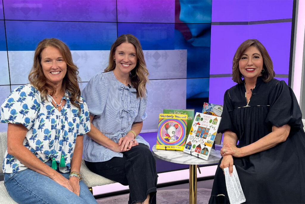 Picture of Dr. Laurie Phillips of Homer Pittard Campus School and Dr. Katie Schrodt of MTSU's College of Education with WKRN's Local on 2 hoist Silvia Castanedas 